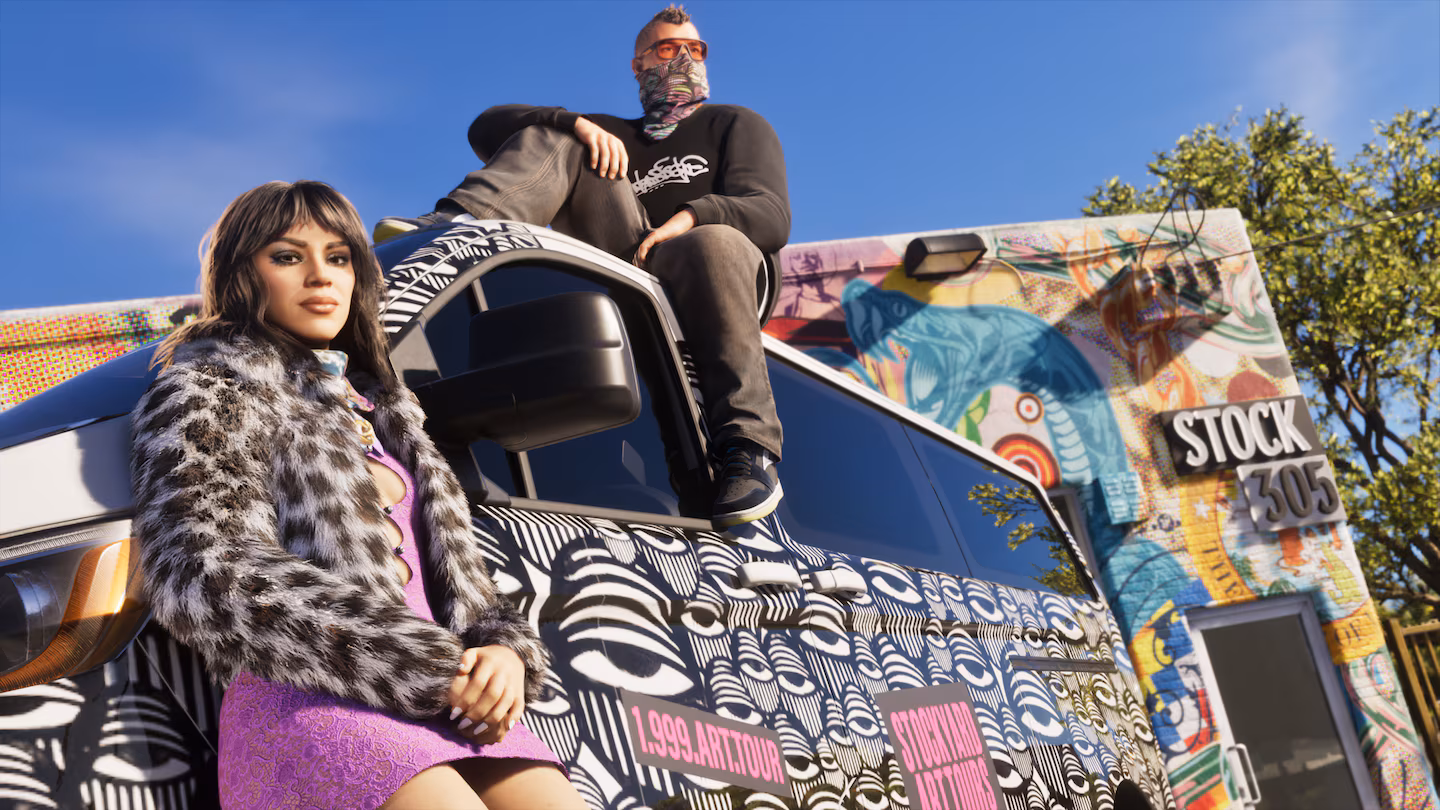 Lucia and Jason posing on a graffiti-covered truck